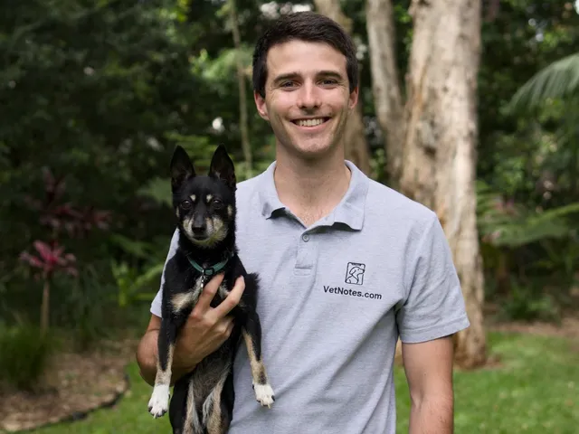 Mitch Sigley with his dog wearing a VetNotes polo shirt